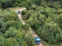 Ciężarówki w lesie na Kolibkach