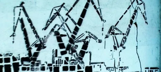 Stocznia to miejsce mocno obecne w sztuce. Na zdjęciu kadr z filmu, przedstawiający mural Iwony Zając znajdujący się na murze otaczający postoczniowe tereny.