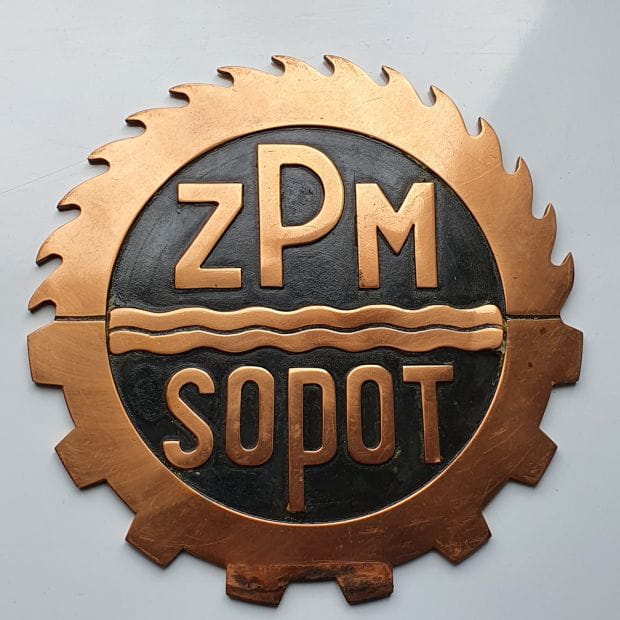 Logo Zakładów Przemysłu Maszynowego w Sopocie.